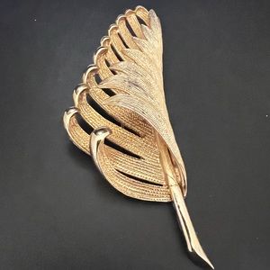 Turning leaf brooch